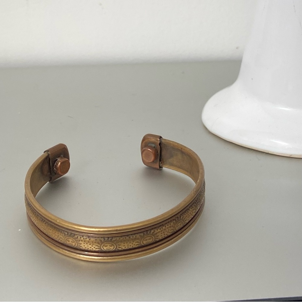 Vintage women copper and brass sun etched design cuff magnetic bracelet. Used.